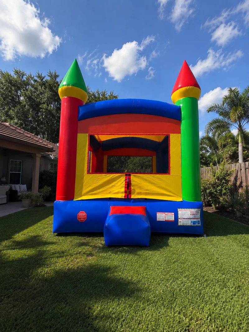 Rainbow Castle Bounce House from Gaby’s Bounce & Splash Rentals set up outdoors in Southwest Florida